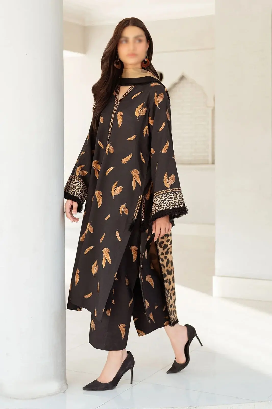 Baroque black lawn suit with feather and leopard print, styled with mustard dupatta