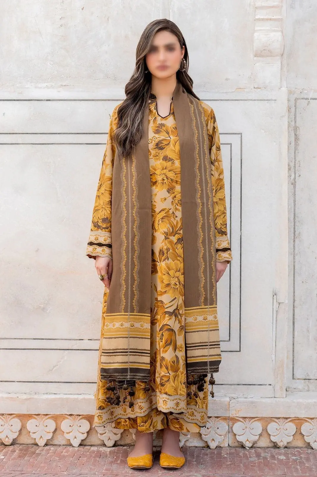 Model wearing mustard-beige Baroque embroidered suit with brown dupatta and ethnic