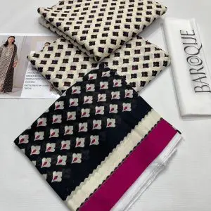 Closeup view of digitally printed shirt, trouser, and black dupatta with maroon floral accents.