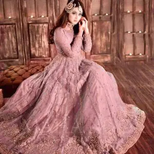 Model wearing Hira Mani blush net frock with heavy embroidery and mirror work – front view