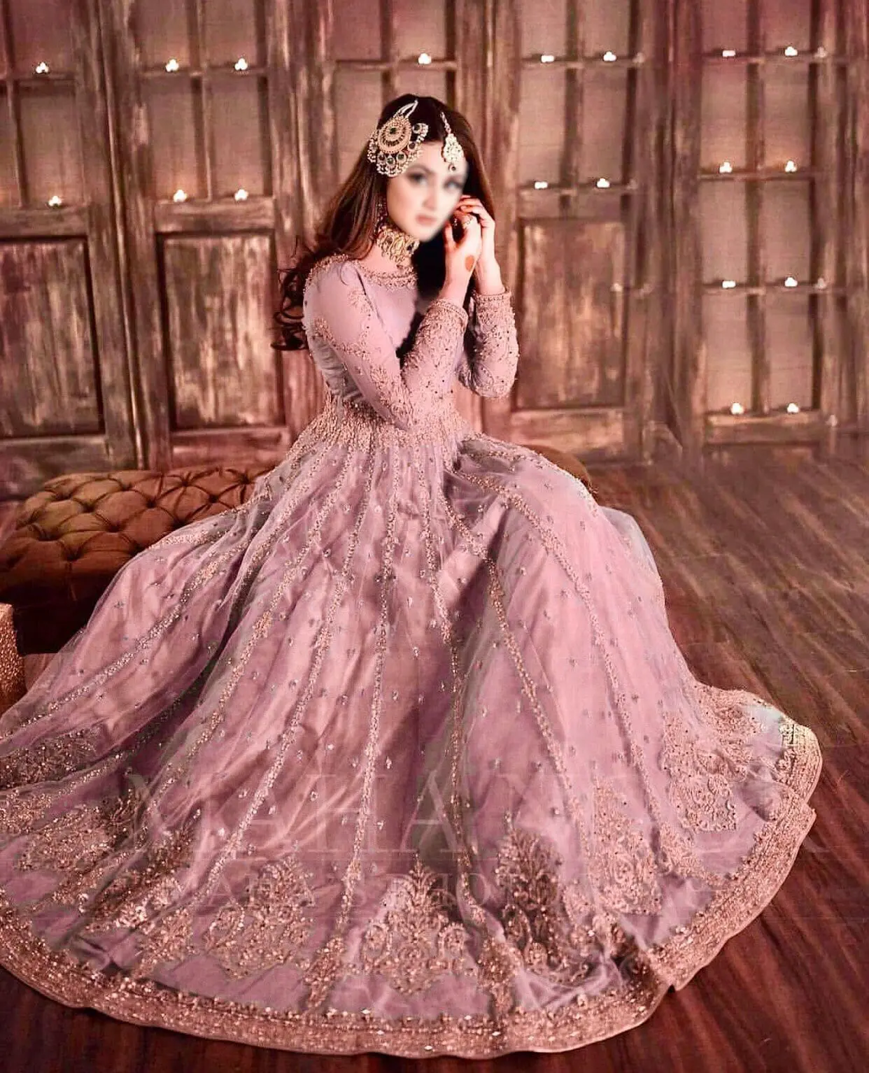 Model wearing Hira Mani blush net frock with heavy embroidery and mirror work – front view