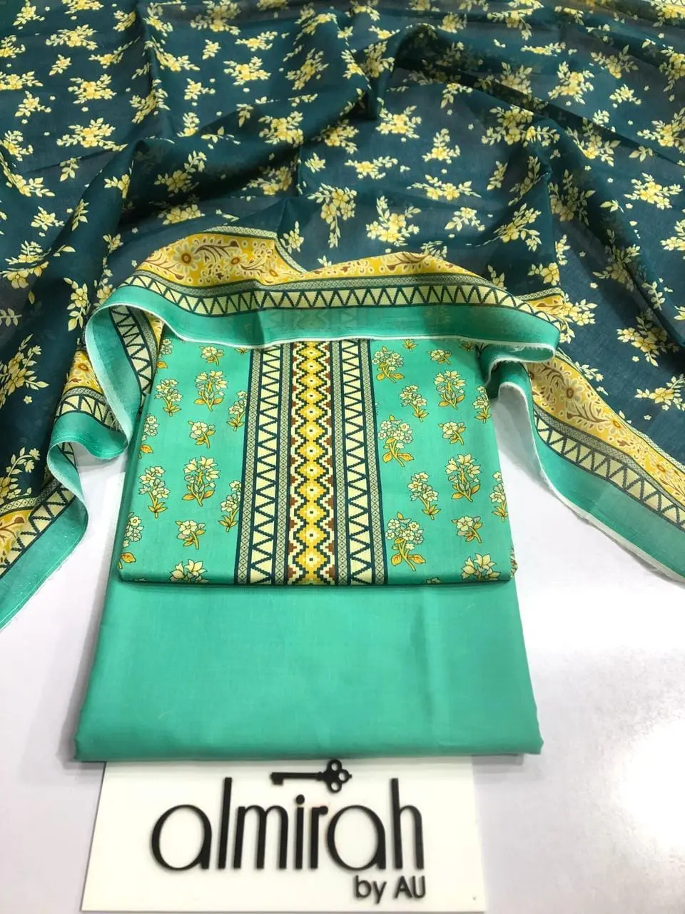 Almirah Design 06 – Ferozi Printed Lawn Suit with Voil Dupatta and Dyed Trousers