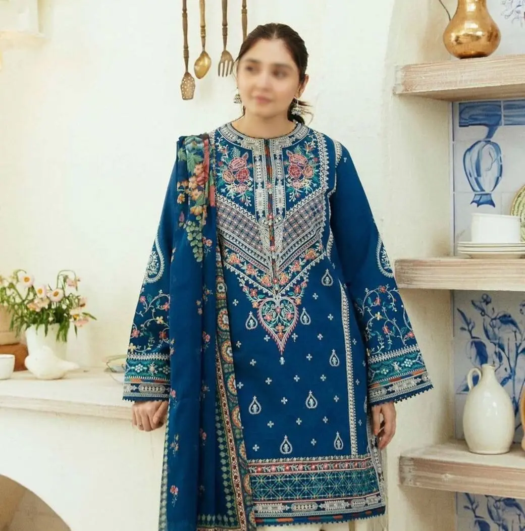 Model wearing COCO by Zara.J royal blue embroidered lawn suit styled with Tarkashi printed dupatta – Summer 2025