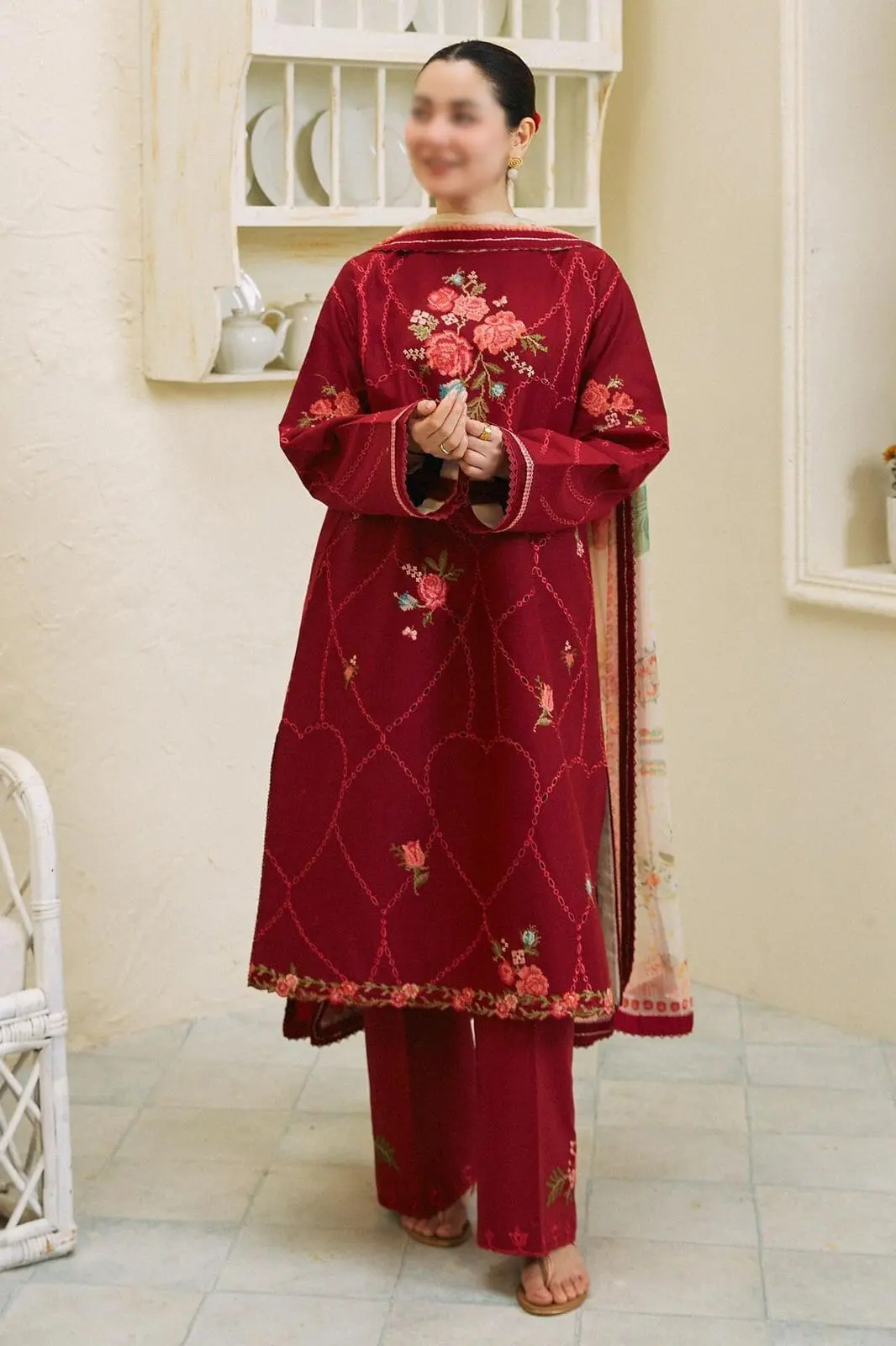 Model wearing COCO by Zara.J crimson red embroidered lawn suit with floral detailing and Tarkashi dupatta – Summer 2025