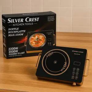 Silver Crest Infrared Cooker 3500W with Gold Handles and Black Crystal Plate on Wooden Table
