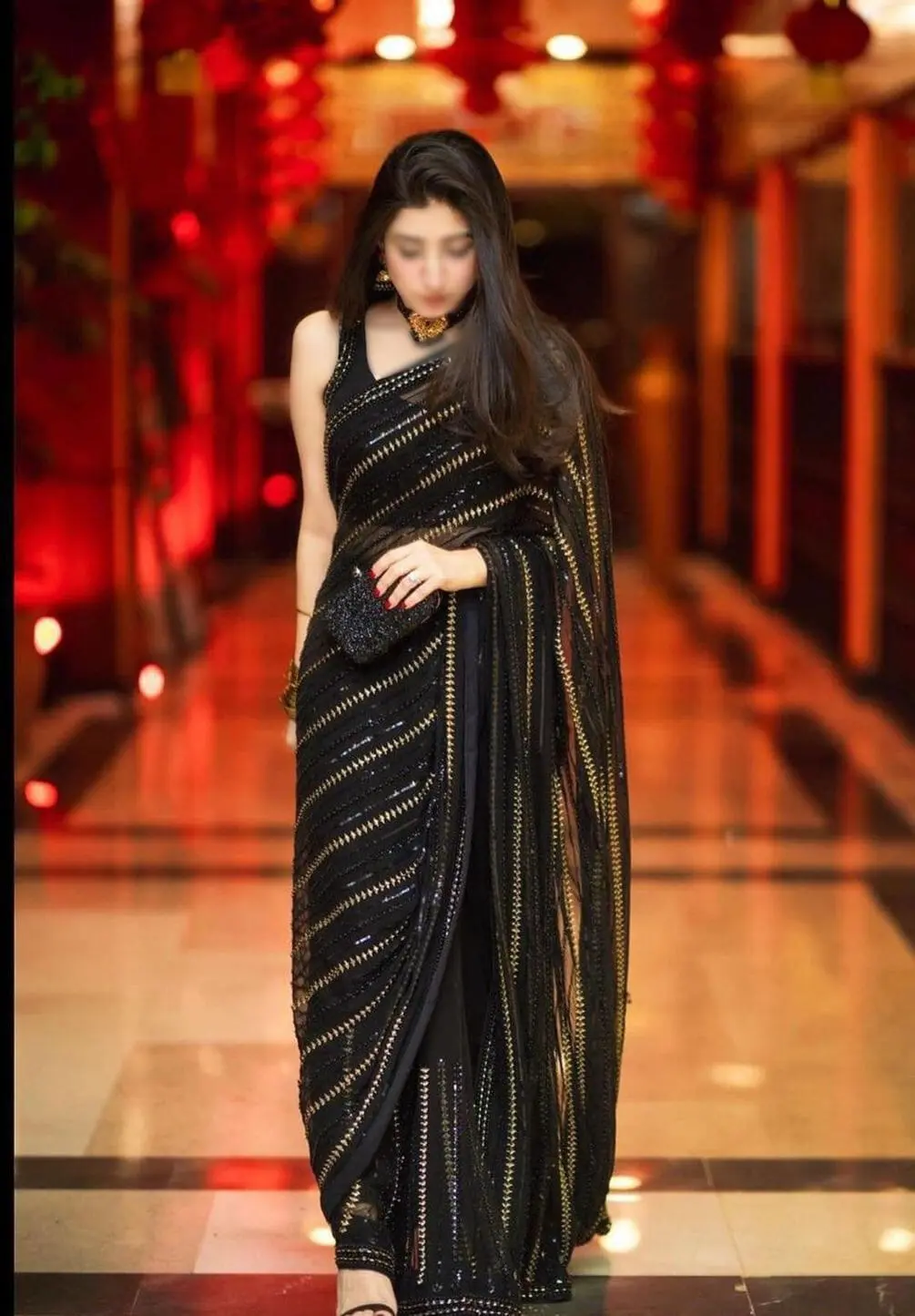 Black chiffon saree with heavy embroidery, pearl work, tassels, and cutwork sleeves – perfect for weddings and parties