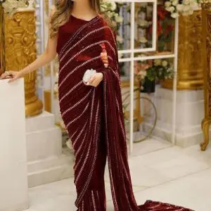Maroon chiffon saree with heavy embroidery, pearl work, tassels, and cutwork sleeves – perfect for weddings and parties